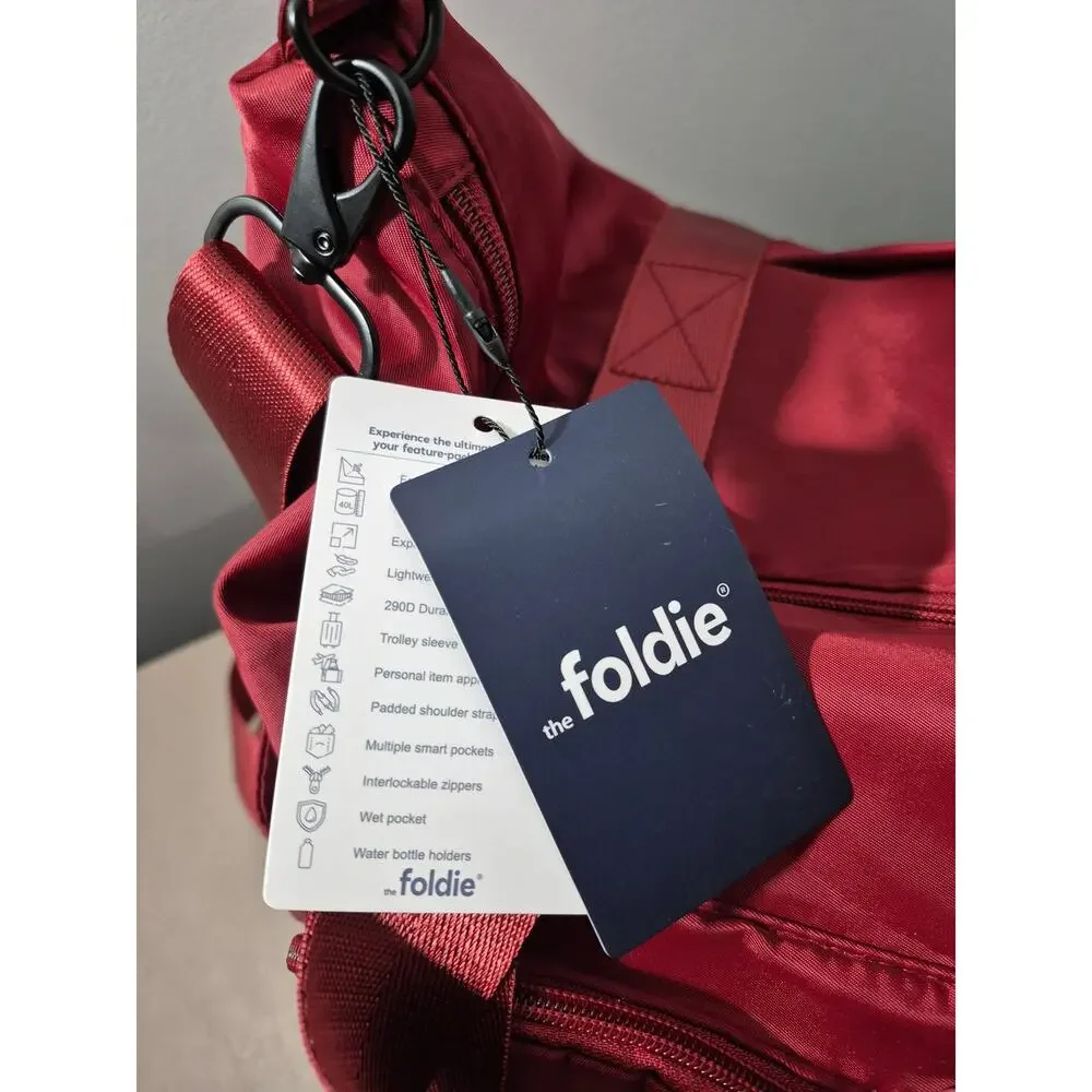 The Foldie Travel Bag NWT Burgundy Expandable Weekender Carry On Tote 40L